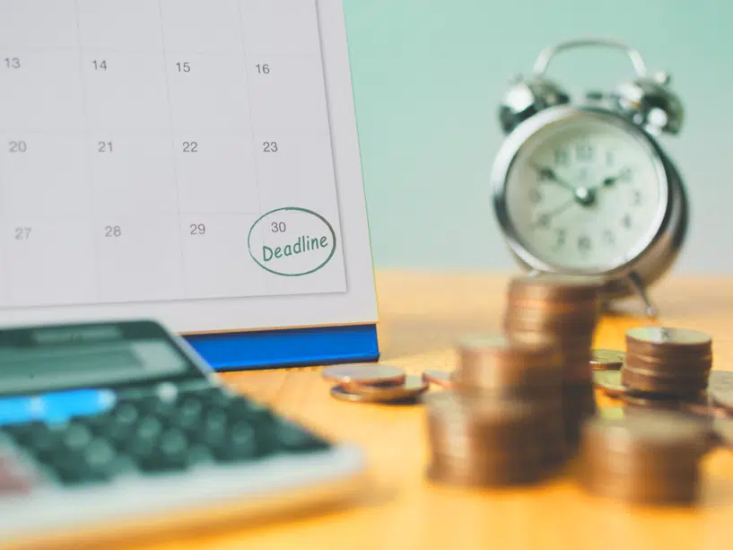 a calendar, clock, calculator and coins represent making a content marketing plan on a budget